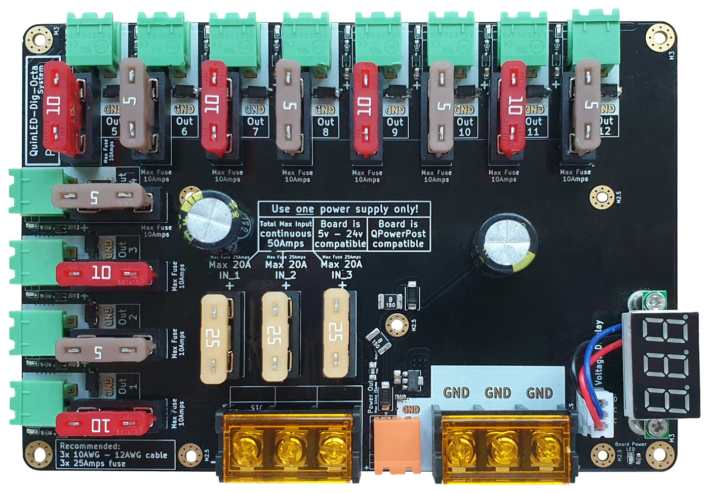 QuinLED-Dig-Octa Power-5 powerboard: black PCB with 12 green pluggable outputs, automotive blade fuses, brass busbar input posts and red voltage display